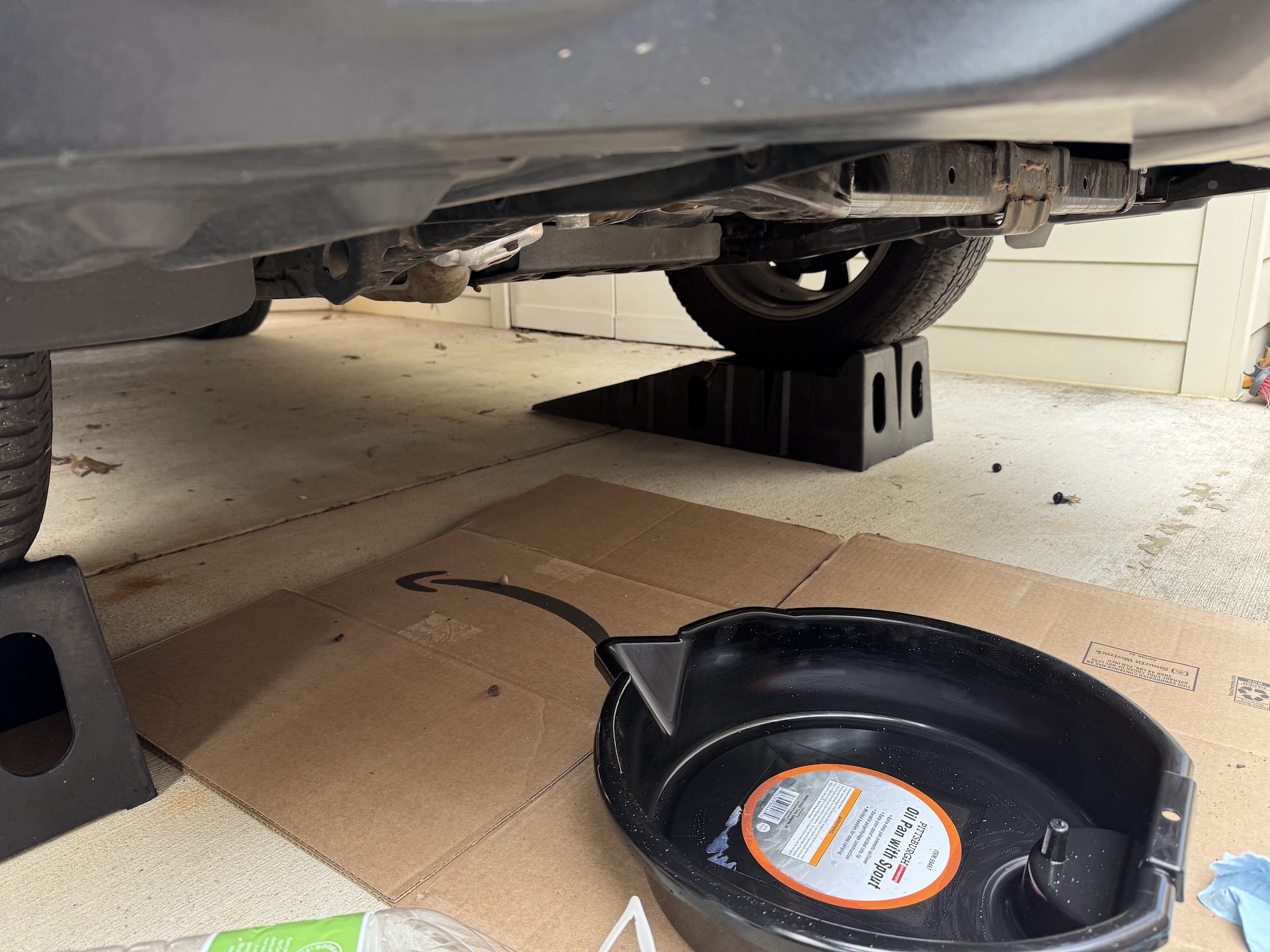 Drain pan under car