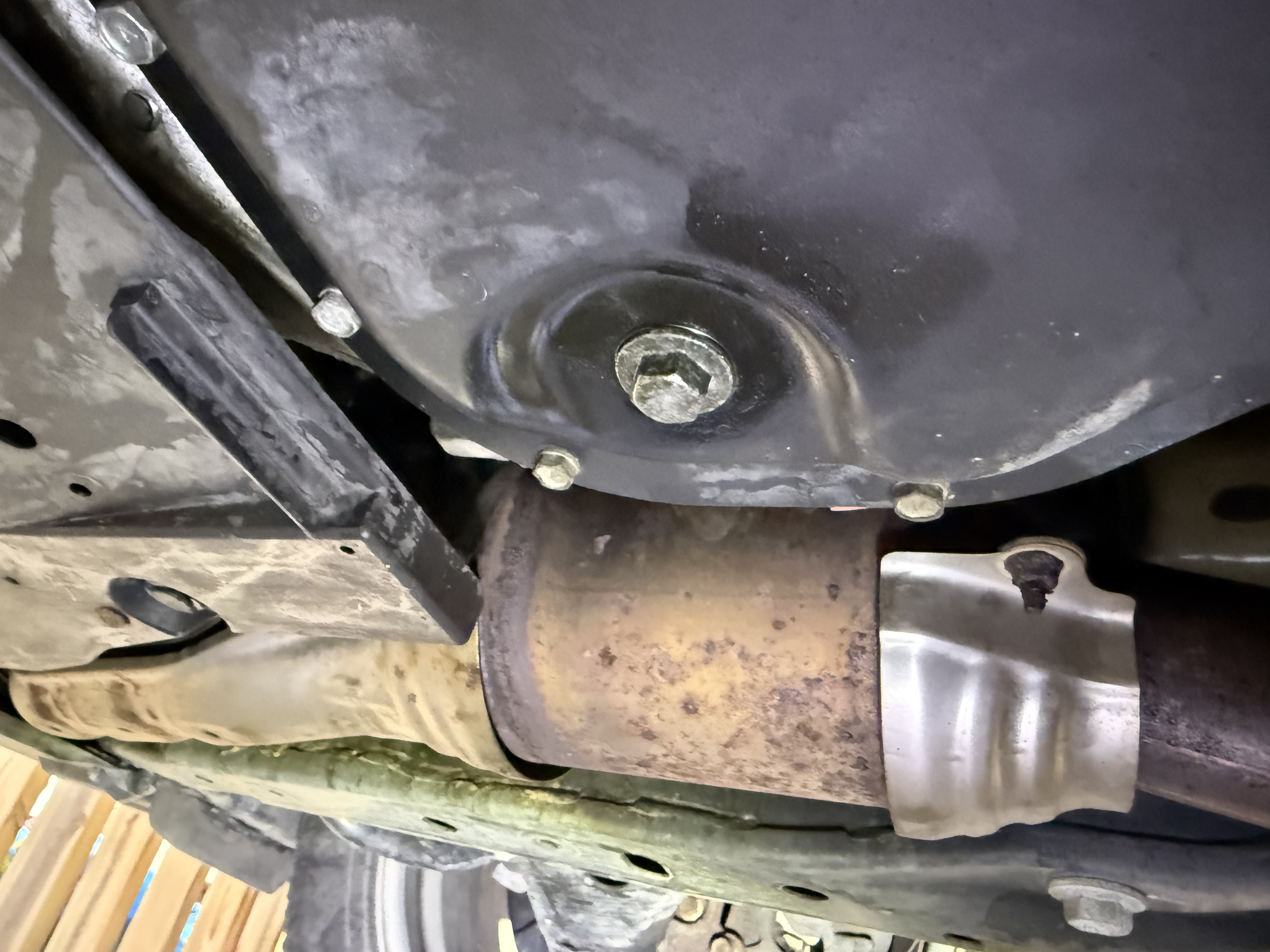 Drain bolt already wet — it was leaking