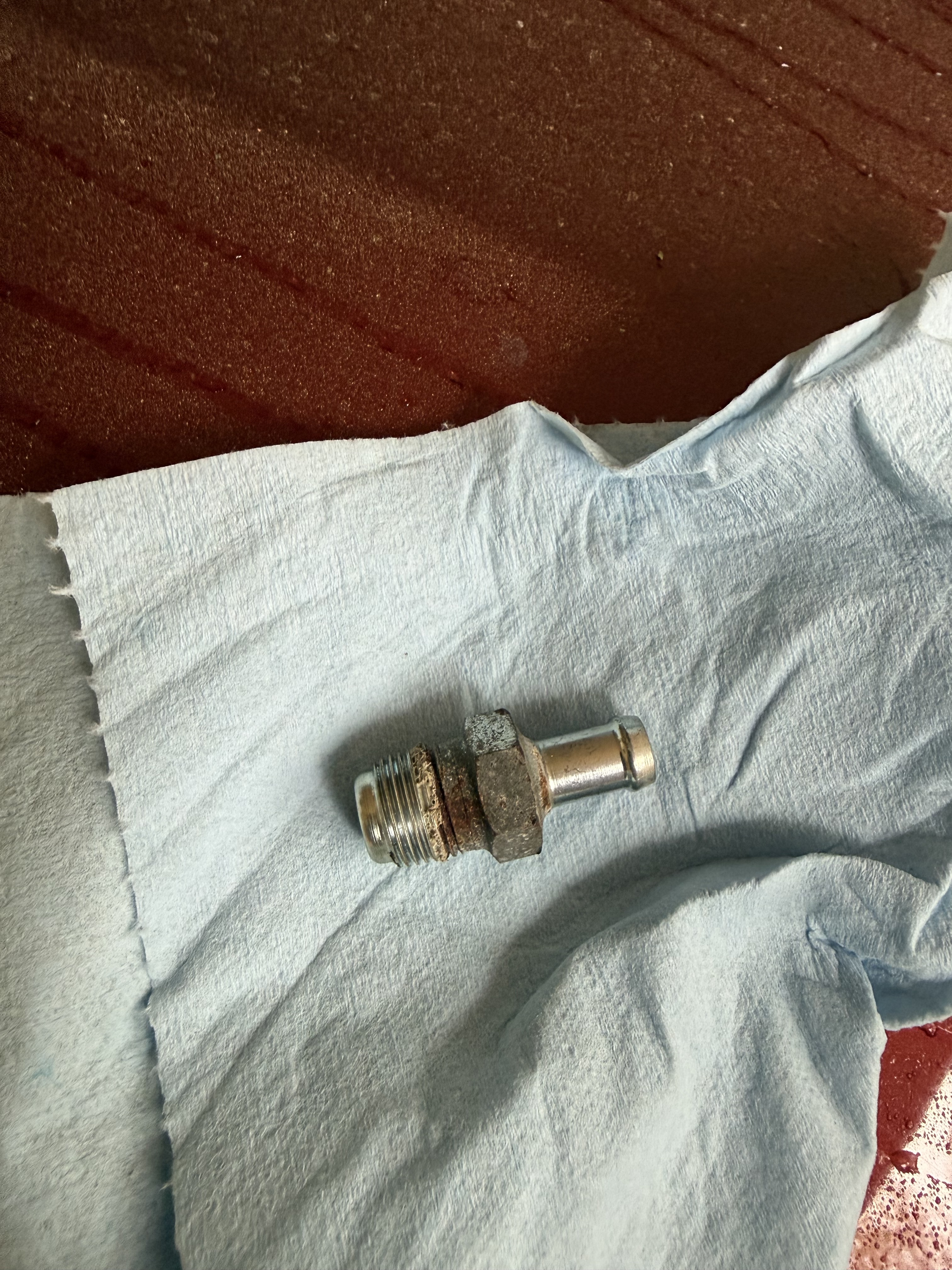 Old PCV valve with RTV residue
